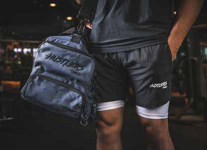 Men in Shorts hanging Gym Duffel Bag | HustlersOnlyUK